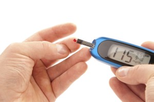 Diabetic patient doing glucose level blood test